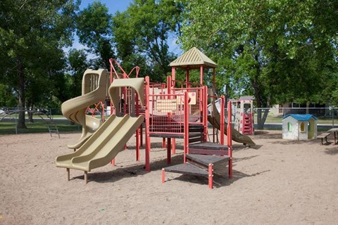 Playground with several slides and a gazebo at Parkwest Gardens West Fargo, ND 58078