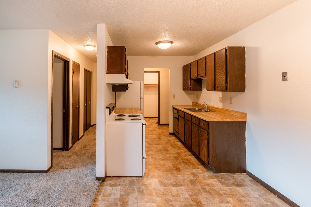 Fargo, ND Patricia Ann Apartments. A kitchen with a stove and a sink
