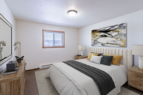 a bedroom with a bed and a window. Fargo, ND Plumtree Apartments