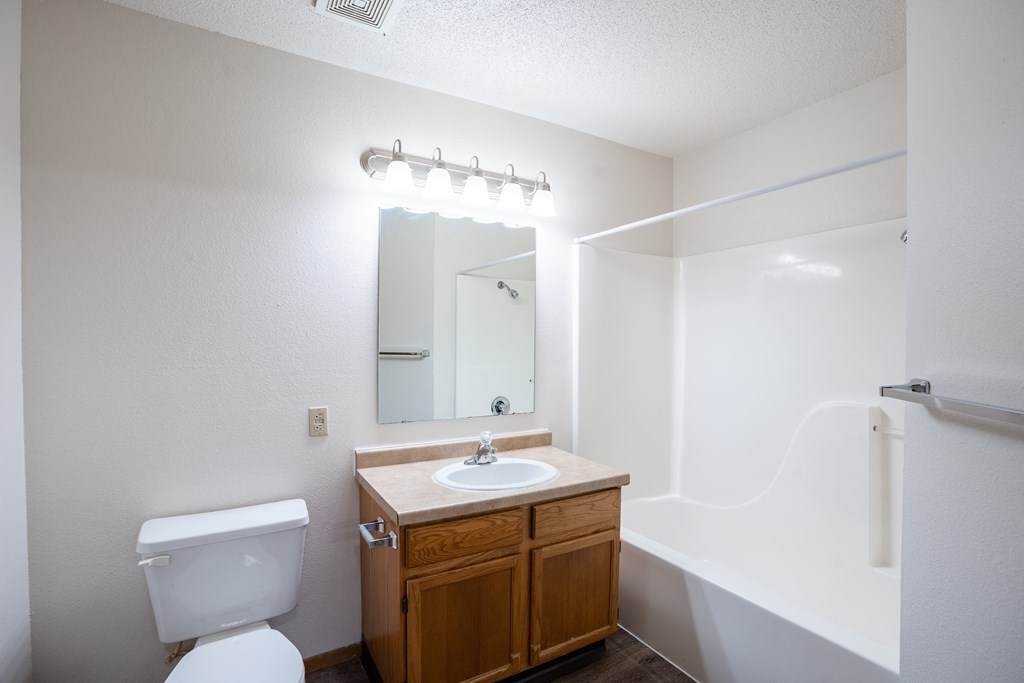 the preserve at ballantyne commons apartment bathroom with toilet sink and mirror
