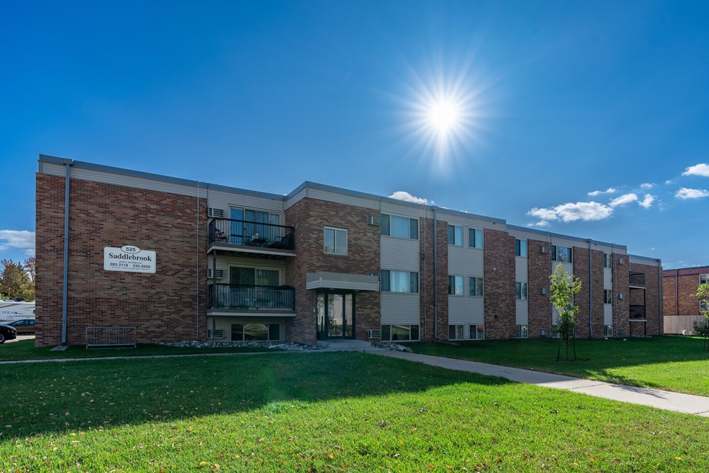 Fargo, ND Saddlebrook Apartments. An exterior of a three level apartment building.