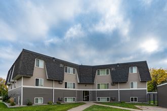 Fargo, ND Summerfield Apartments. A large apartment building with a roof shaped like a pyramid