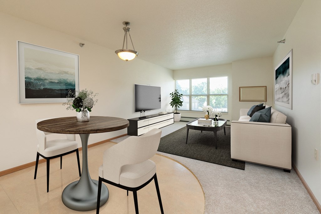 Fargo, ND Sunrise North | Dining a living room with a couch and a table and a television. Fargo, ND Sunrise North