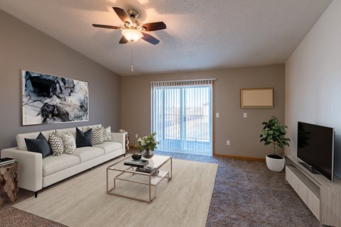 an open living room with a couch and a tv
