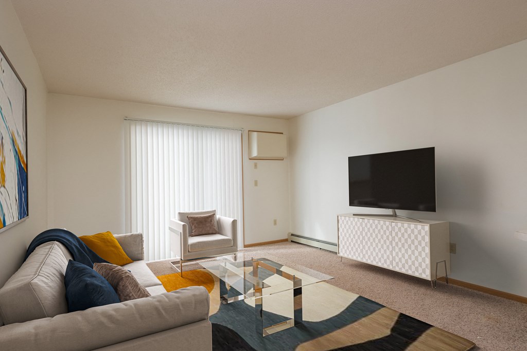 Fargo, ND Twin Parks Apartments. this is a photo of the living room in a 1 bedroom apartment at deer hill apartments in