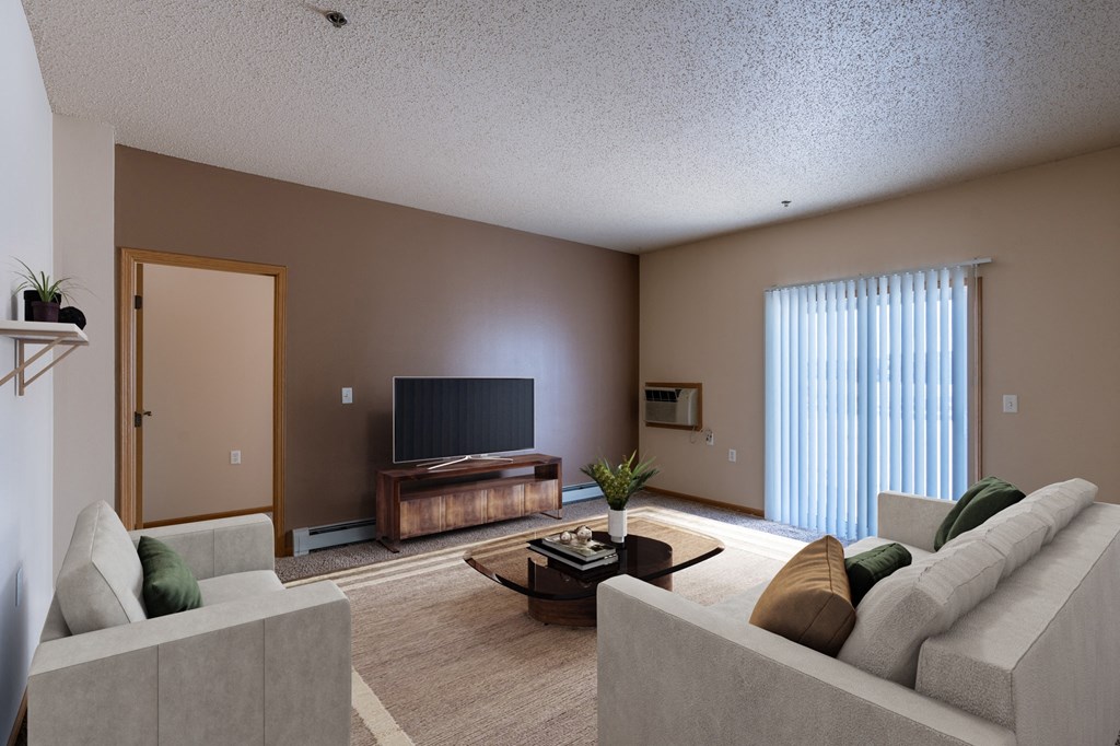 a living room with a couch and a tv. Fargo, ND West Lake Apartments