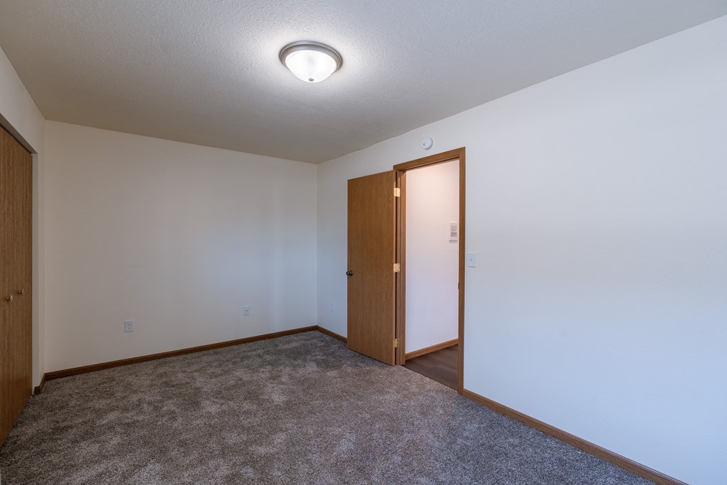 a bedroom with a closet. Fargo, ND Westwood Apartments