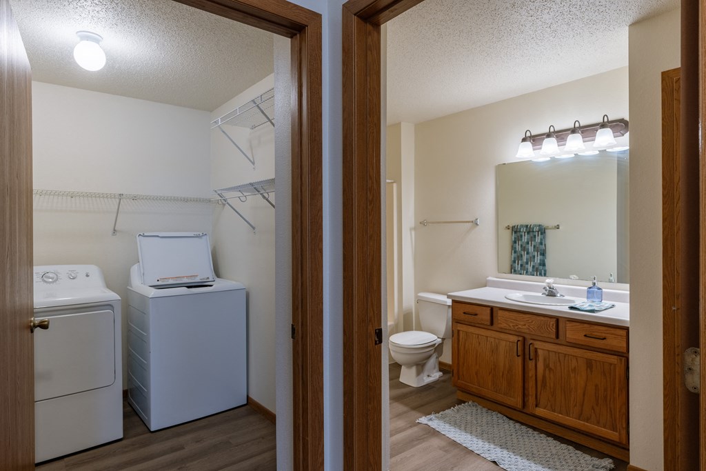a bathroom and laundry room. Fargo, ND Willow Park Apartments