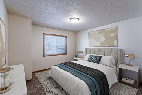 Fargo, ND Willow Park Apartments | Bedroom a bedroom with a bed and a window. Fargo, ND Willow Park Apartments