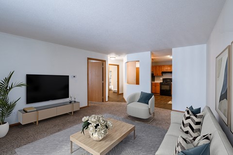 a living room with a couch and a coffee table and a television