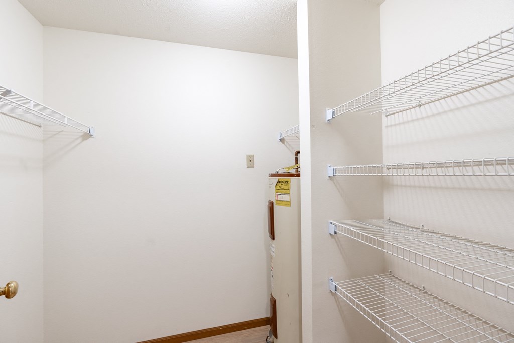 the closets in both bedrooms are closets with wire shelves. Fargo, ND Flagstone Apartments