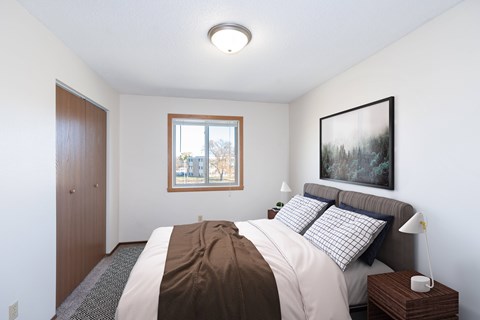Fargo, ND Hartford Apartments | 11A | Bedroom a bedroom with a bed and a window. Fargo, ND Hartford Apartments