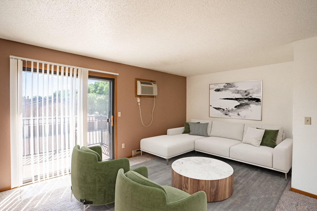 a living room with a couch and chairs and a table. Fargo, ND Hunters Run 2 Apartments