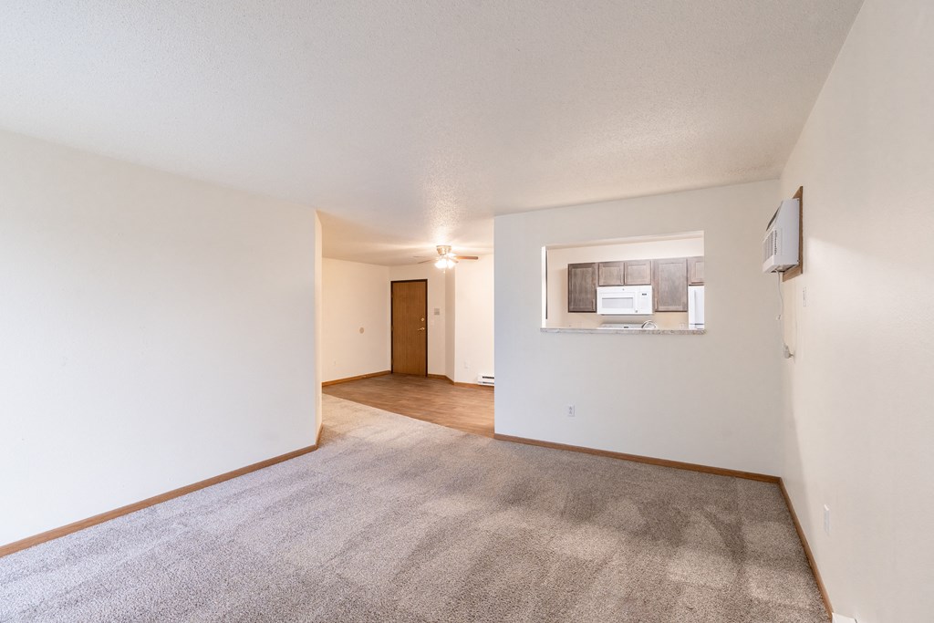 the living room and dining room of an apartment. Fargo, ND Oxford Apartments