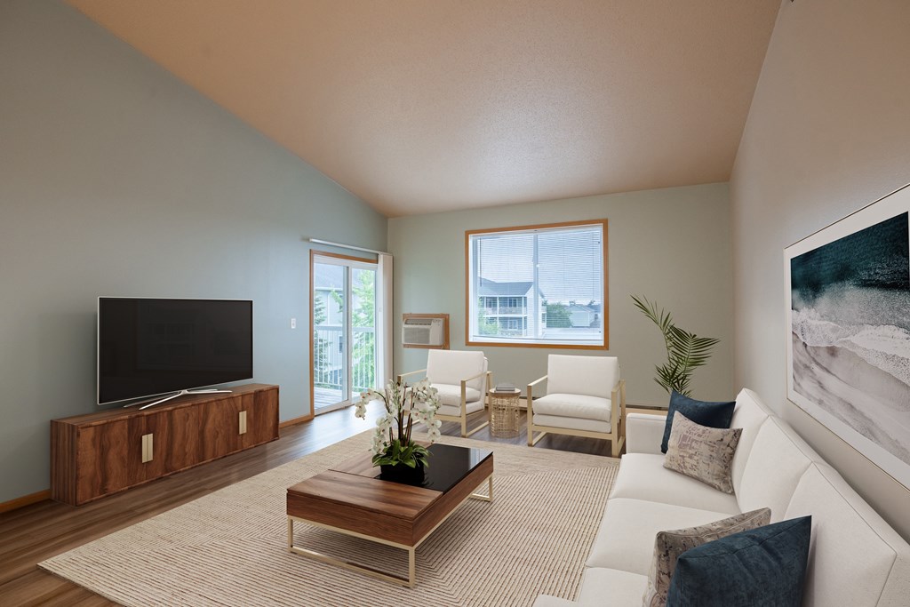 a living room with a couch and a coffee table. Fargo, ND West Lake Apartments