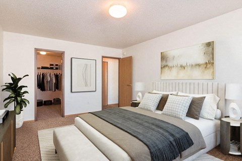Fargo, ND Foxtail Creek Townhomes | Bedroom a bedroom with a bed and a closet. Fargo, ND Foxtail Creek Townhomes