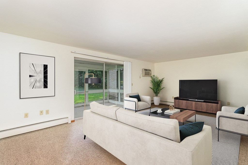 a living room with a couch and a tv.  Golden Valley, MN Valley View Apartments