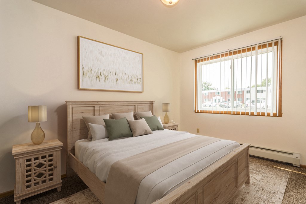 Grand Forks, ND Amberwood Apartments a bedroom with a large bed and windows