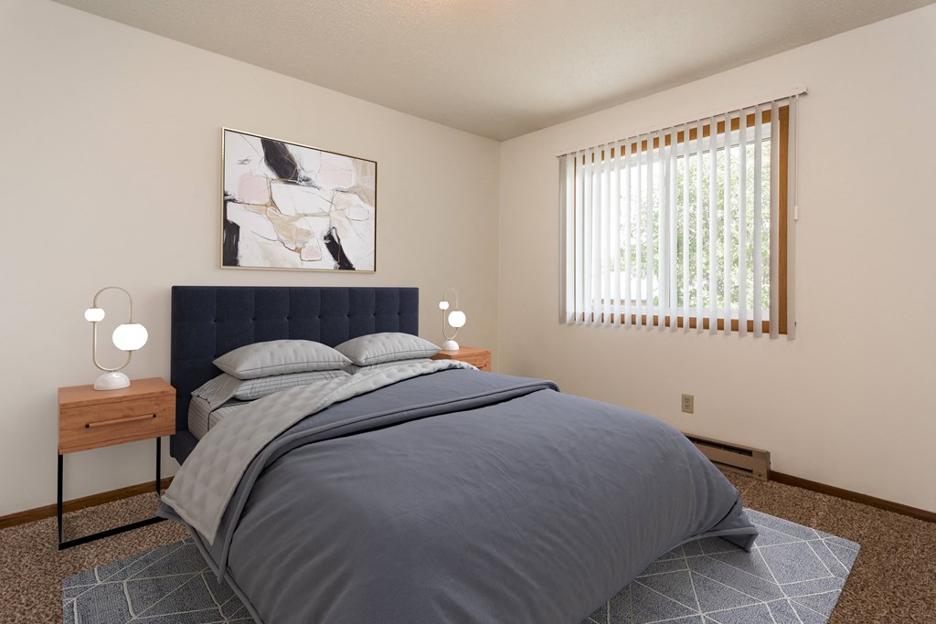 Grand Forks, ND Autumn Apartments | Bedroom Grand Forks, ND Autumn Apartments. A bedroom with a bed and two night stands with a window