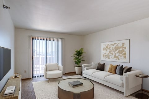 a living room with a couch and a coffee table. Grand Forks, ND Autumn Ridge Apartments