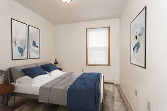 Grand Forks, ND Bristol Park Apartments. a bedroom with a bed and a window - Photo Gallery 5