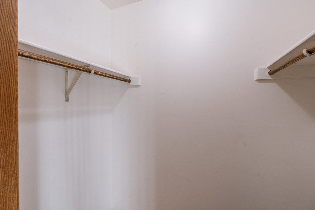 an empty closet with white walls. Grand Forks, ND Cedarwood Apartments