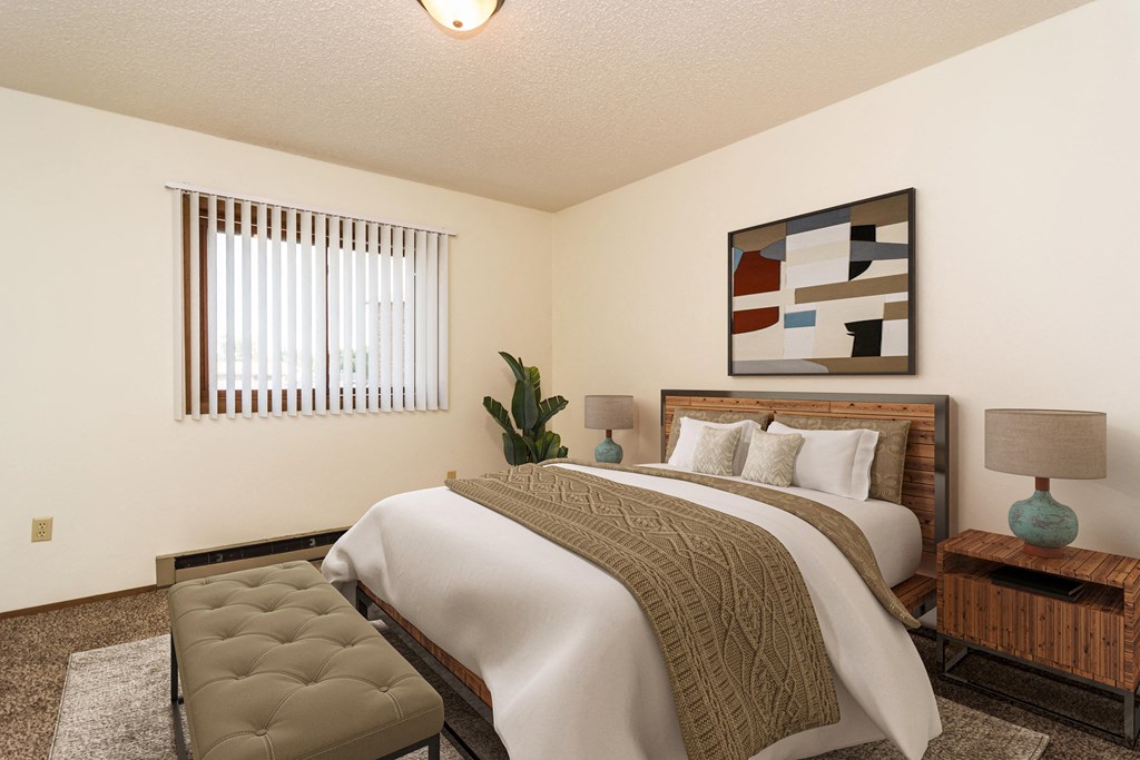 Grand Forks, Chandler 1802 Apartments.  A bedroom with a bed and a window