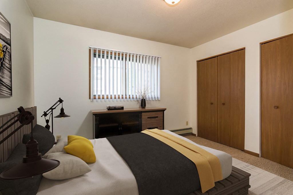 Grand Forks, ND Columbia West Apartments a bedroom with a bed and a dresser