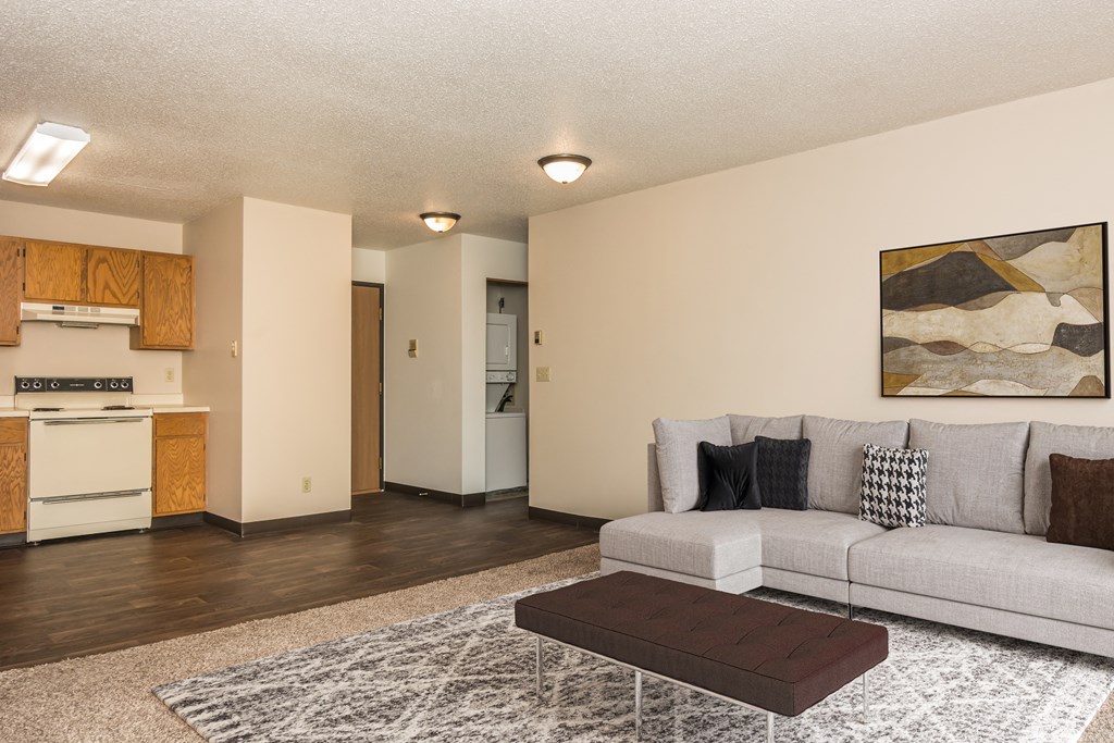 Grand Forks, ND Columbia West Apartments. a living room with a couch and a coffee table