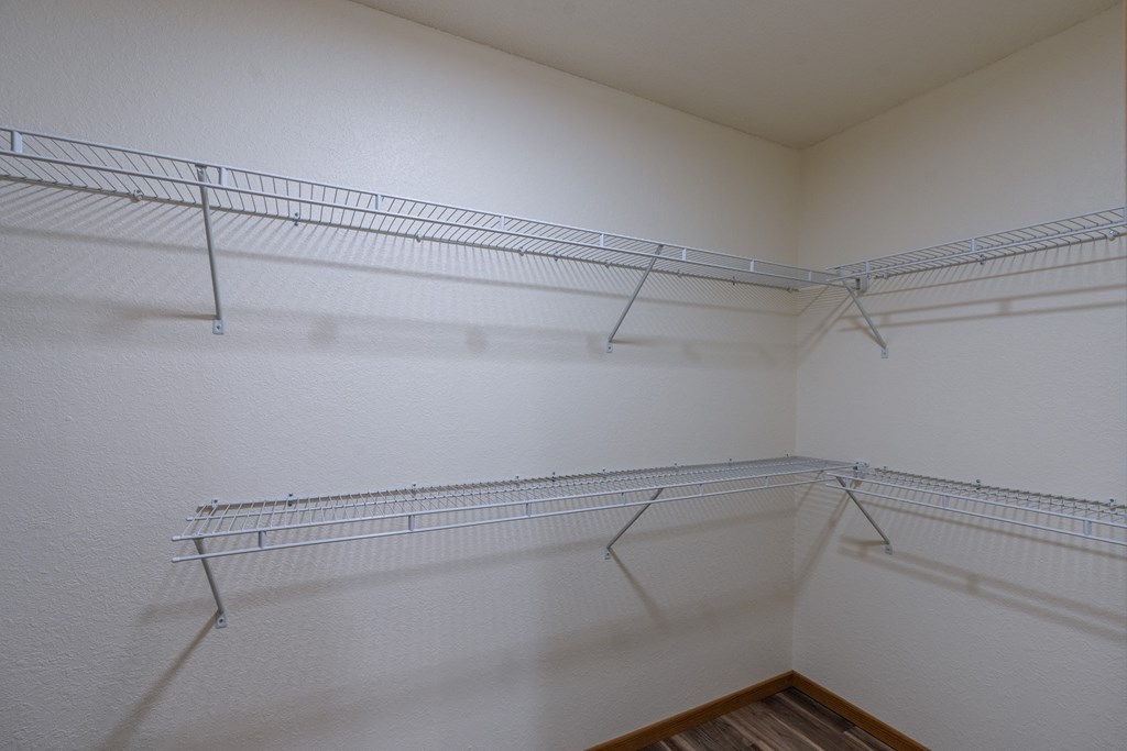 Grand Forks, ND Grandview Apartments. A closet with two rows of shelves.