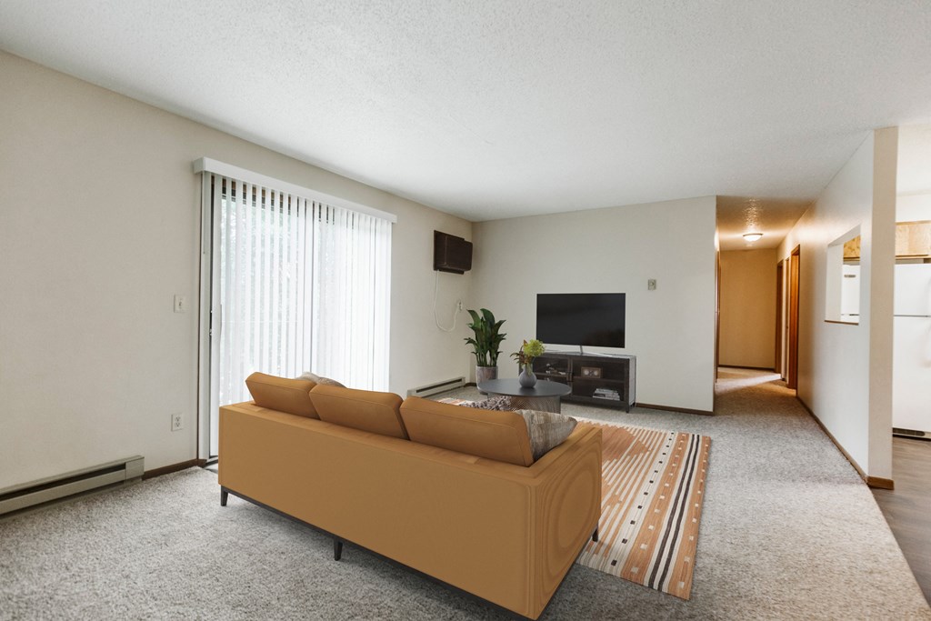 a living room with a couch and a tv  at Harrison and Richfield, Grand Forks, 58201