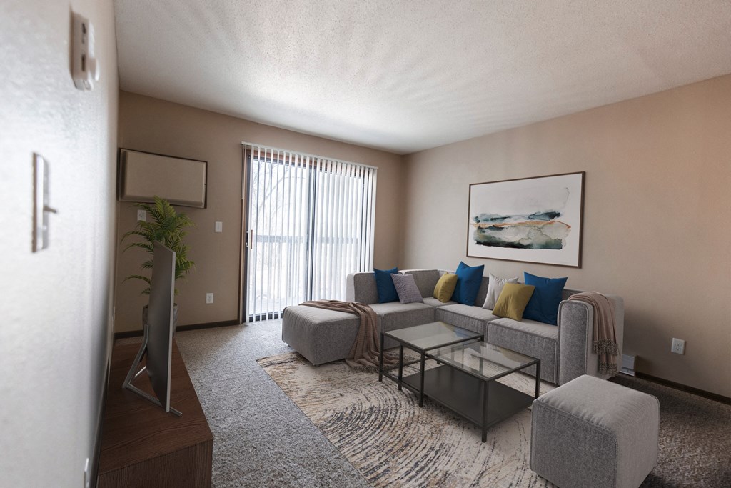 Grand Forks, ND Library Lane Apartments a living room with a gray couch and a coffee table with a glass sliding door
