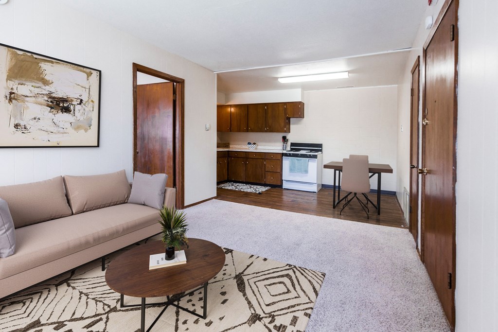 Grand Forks, ND Library Lane Apartments a living room with a couch and a table