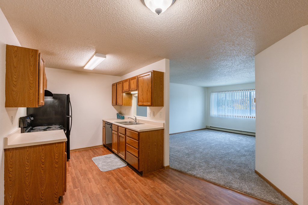 Grand Forks, ND Southview Apartments. A kitchen with white appliances.