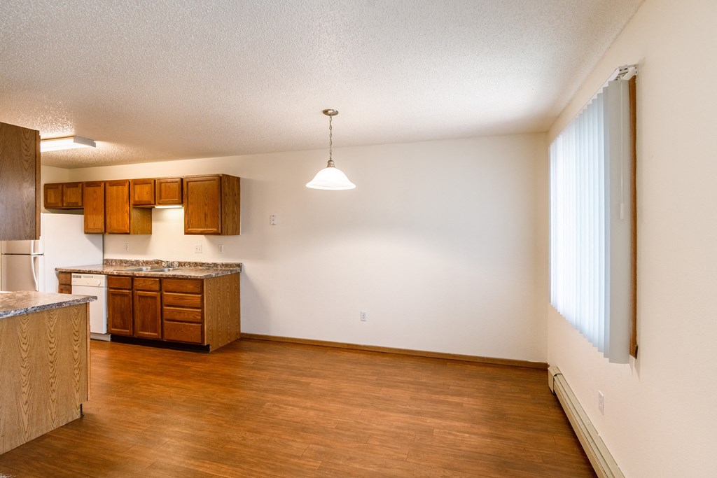 Grand Forks, ND Southview III Apartments. A kitchen with wood flooring and a large window