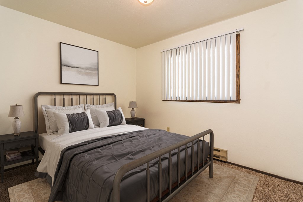 Grand Forks, ND Stanford Court Apartments  a bedroom with a bed and a window