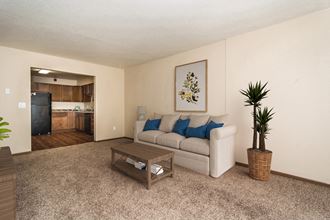 Grand Forks, ND Stanford Court Apartments  a living room with a couch and a coffee table