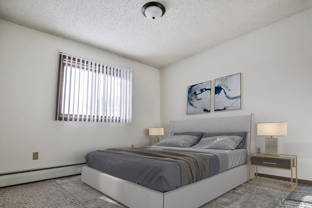 . Grand Forks, ND Sunview apartments. a bedroom with a bed and two night stands with a window