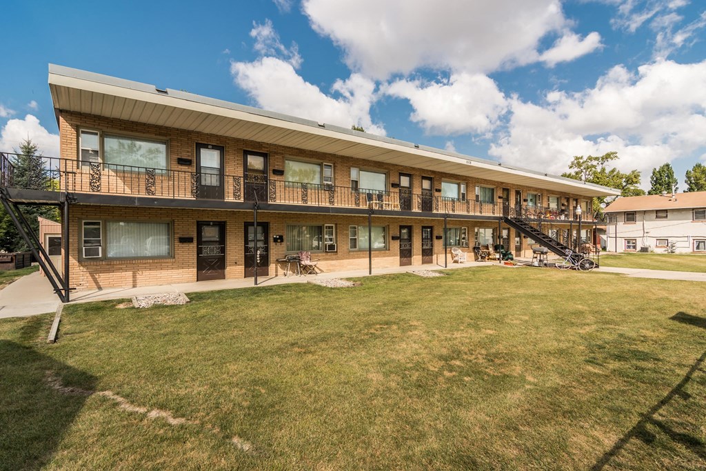 Grand Forks, ND Washington Apartments. Exterior with patios and large grassy area
