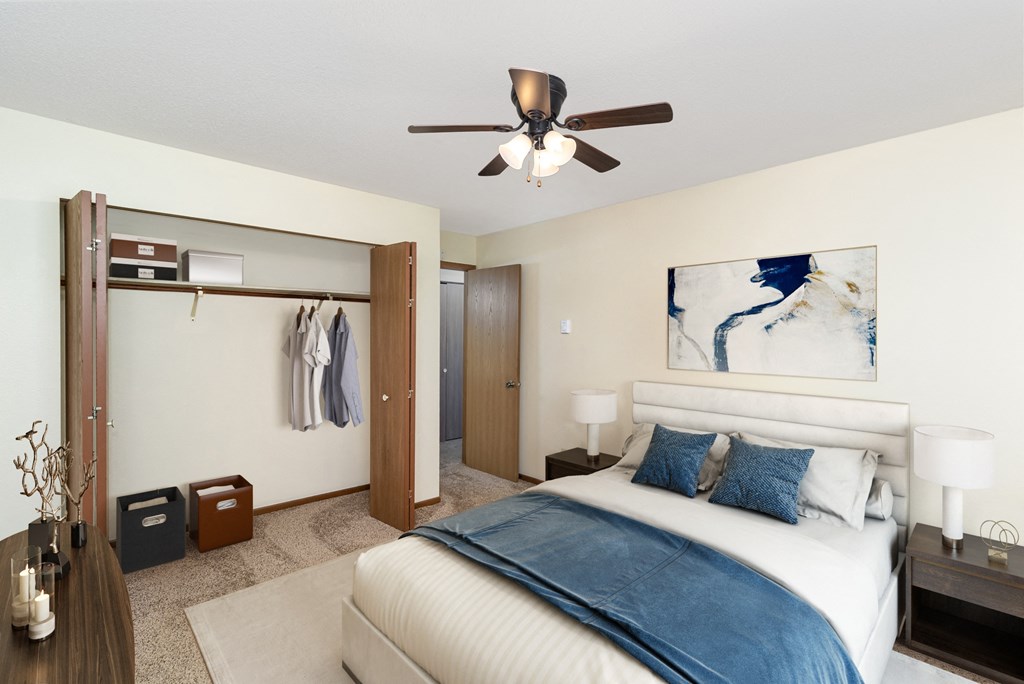 Hutchinson, MN Twin Oaks | 21A| Bedroom a bedroom with a large bed and a ceiling fan. Hutchinson, MN Twin Oaks