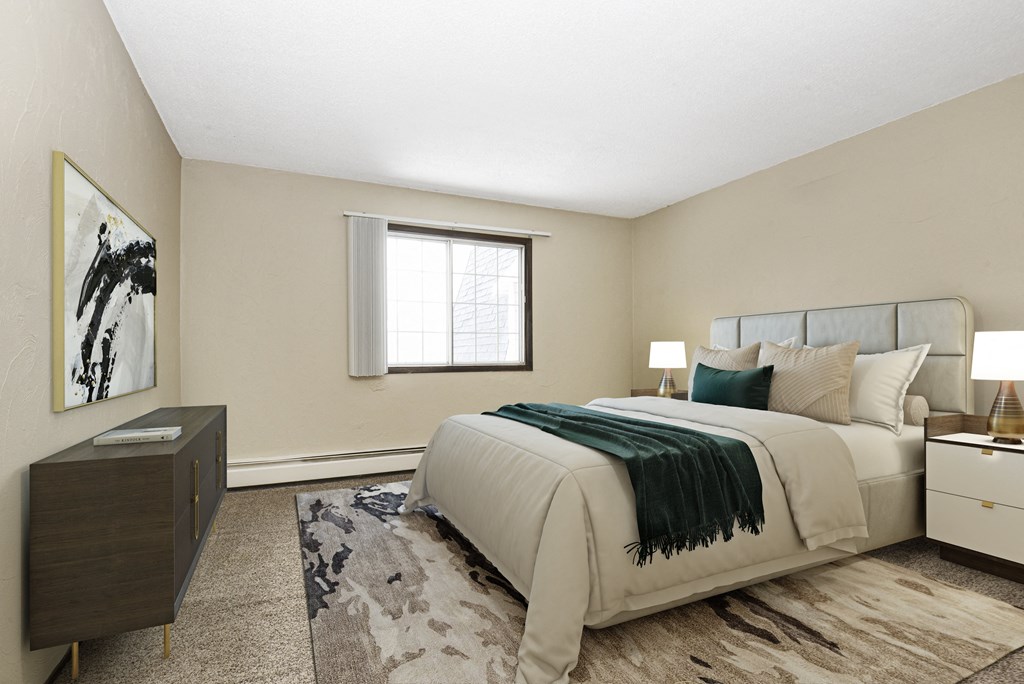 Georgetown on the River Apartments, Fridley, MN, 55432. A bedroom with a bed and a dresser.