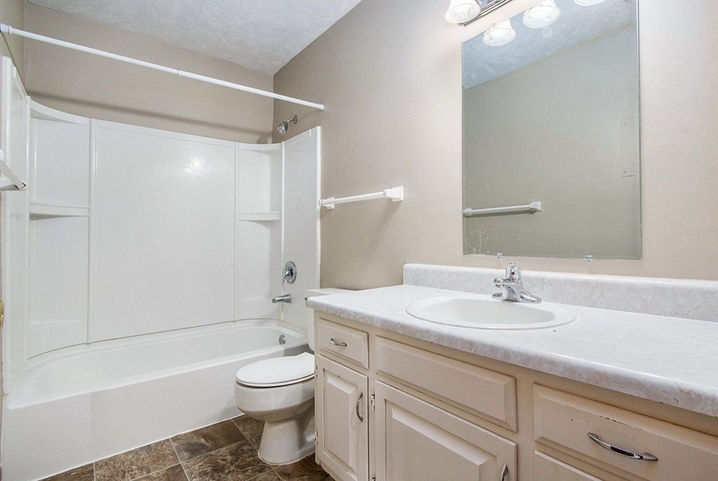 Omaha, NE Maple Ridge Apartments. A bathroom with a sink toilet and bathtub