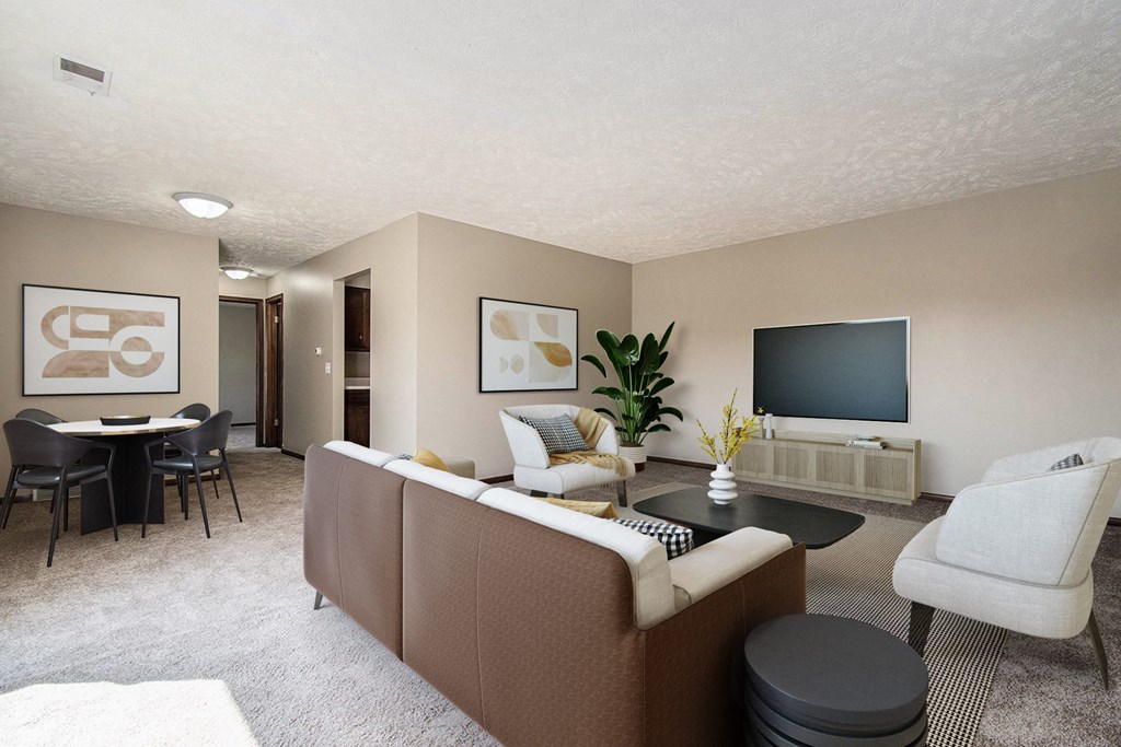 Omaha, NE Maple Ridge Apartments. A living room filled with furniture and a flat screen tv