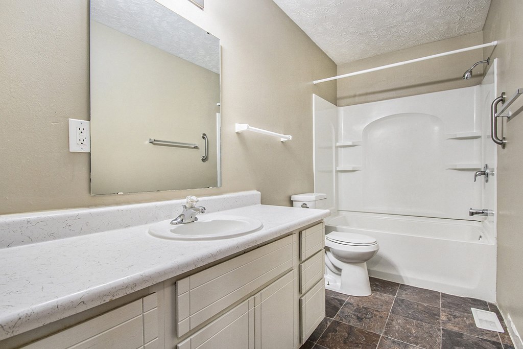 Omaha, NE Stony Brook Townhomes. A bathroom with a sink toilet and shower