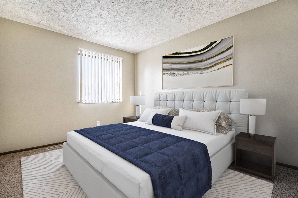 Omaha, NE Stony Brook Townhomes. A bedroom with a bed and a window