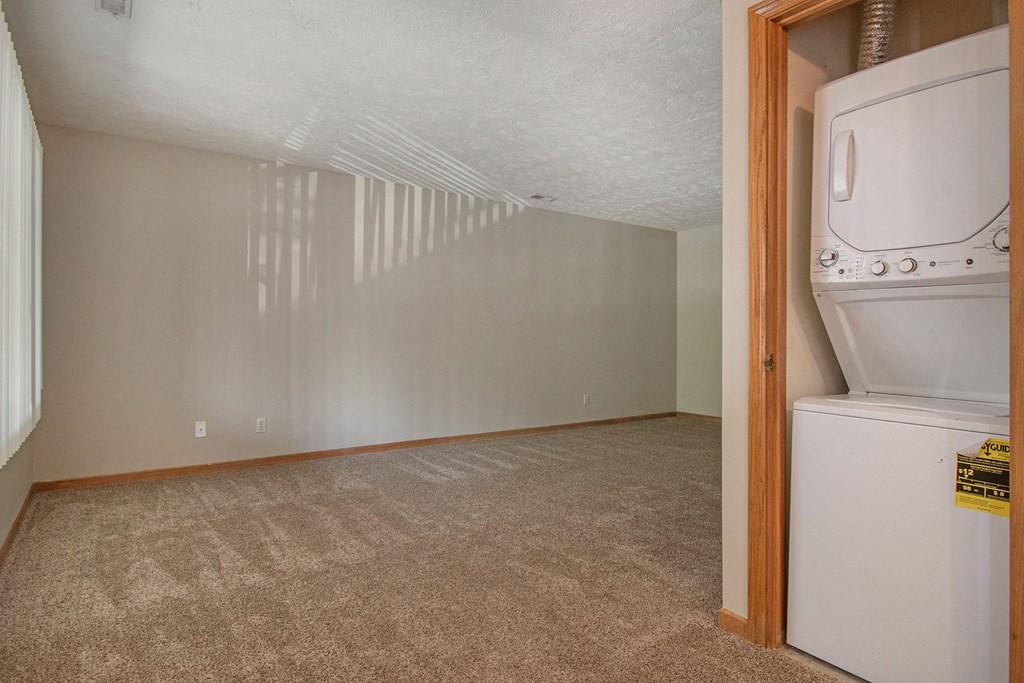Omaha, NE Woodland Pines Apartments. A laundry closet with a washer and dryer