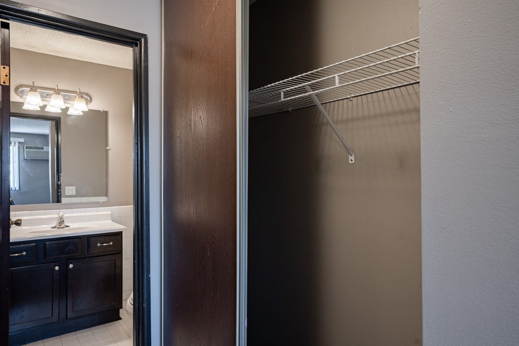 two views of a bathroom with a shower and a sink. Roseville, MN Rosedale Estates Apartments