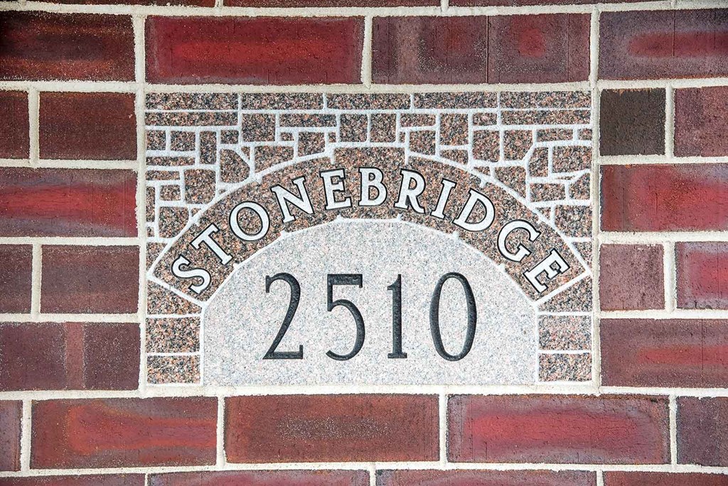 Stonebridge 2510 is etched into this brick wall. Fargo, ND Stonebridge Apartments