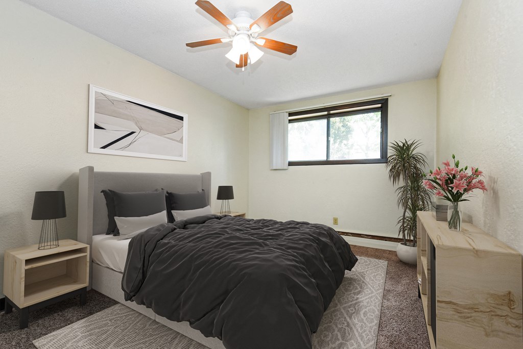 White Bear Lake, MN White Bear Terrace Apartments | Furnished bedroom White Bear Lake, MN White Bear Terrace Apartments. a bedroom with a large bed and a ceiling fan