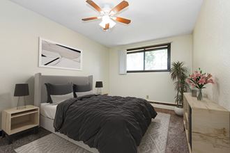 White Bear  Lake, MN White Bear Terrace Apartments. a bedroom with a large bed and a ceiling fan